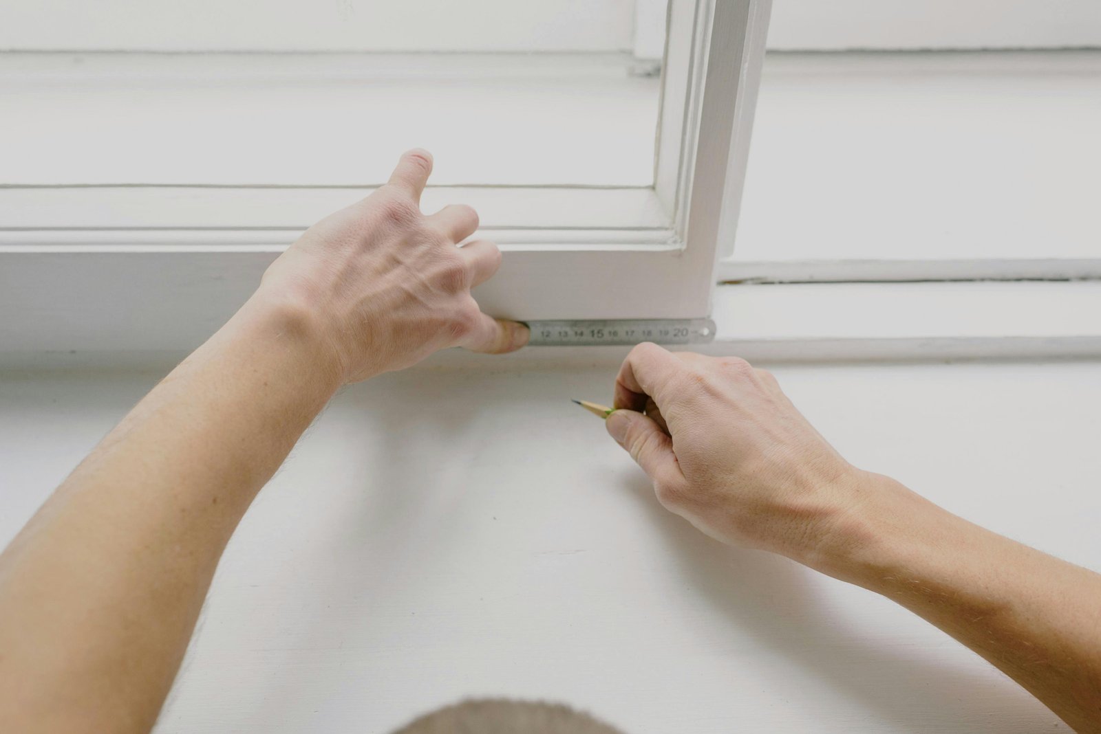 Contractor taking measurements for property maintenance
