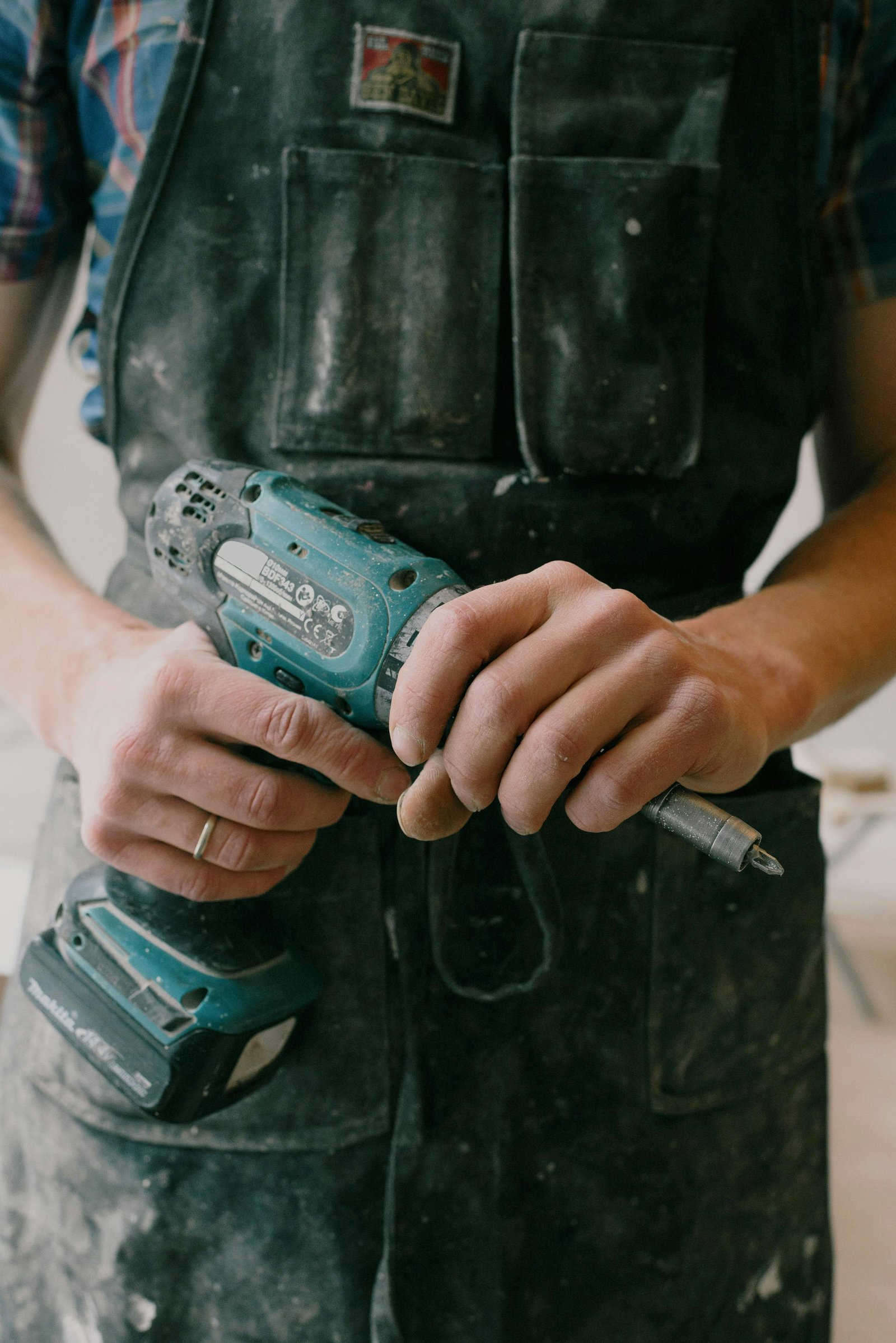 Using a power drill for hardware installation